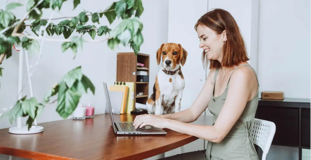 A happy woman working in her home office in western Washington.