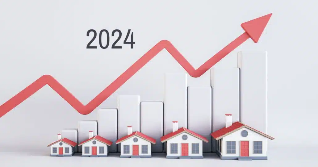 A row of homes with a graph above them indicates an increase in home prices for the upcoming years.